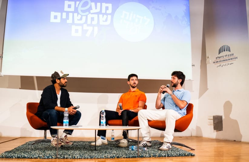Omri Rozenblit, a former contestant on *The Amazing Race Israel* who was wounded while fighting in Gaza, speaks to students at the Liheyot Ye’udi year-end event about identity, values, and resilience.