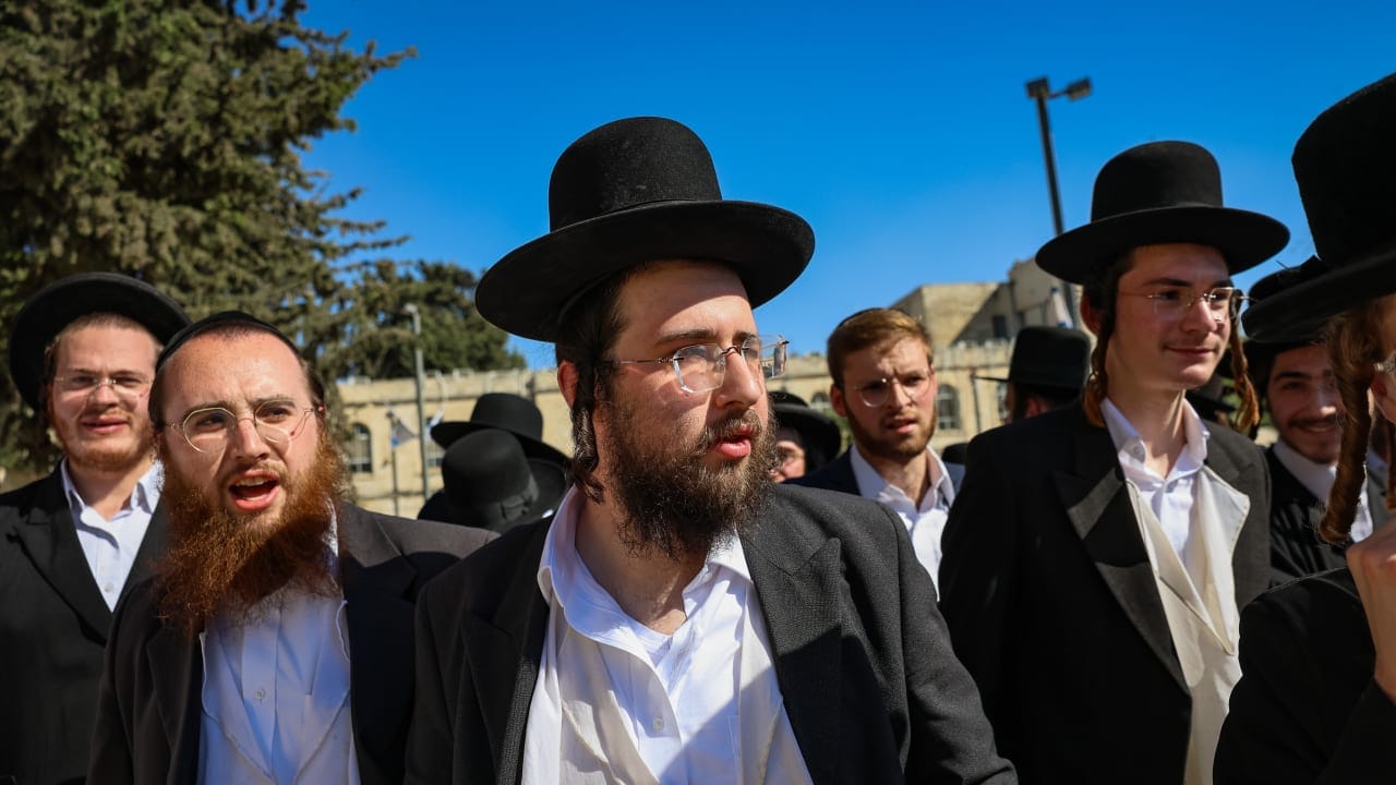 Ultra-Orthodox Jewish protesters demonstrate against the arrest of ultra orthodox jewish men who took part in a protest outside the home of Supreme Court Justice Noam Sohlberg and were later handed over to the military police, outside the Abu Kabir detention facility in Tel Aviv, June 10, 2026.