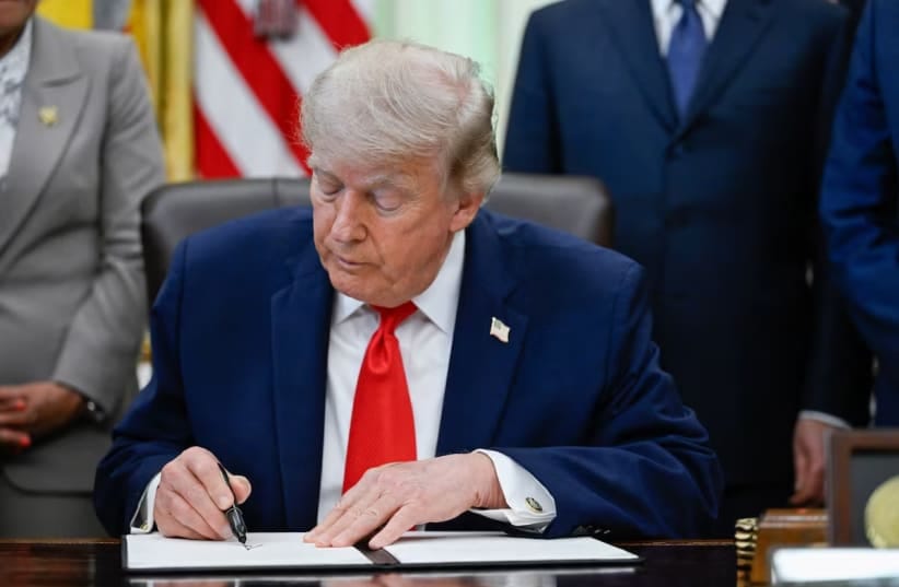 US President Donald Trump signs a proclamation for restoring American commercial fishing in the Pacific, in the Oval Office at the White House in Washington, DC, US, June 11, 2026. 