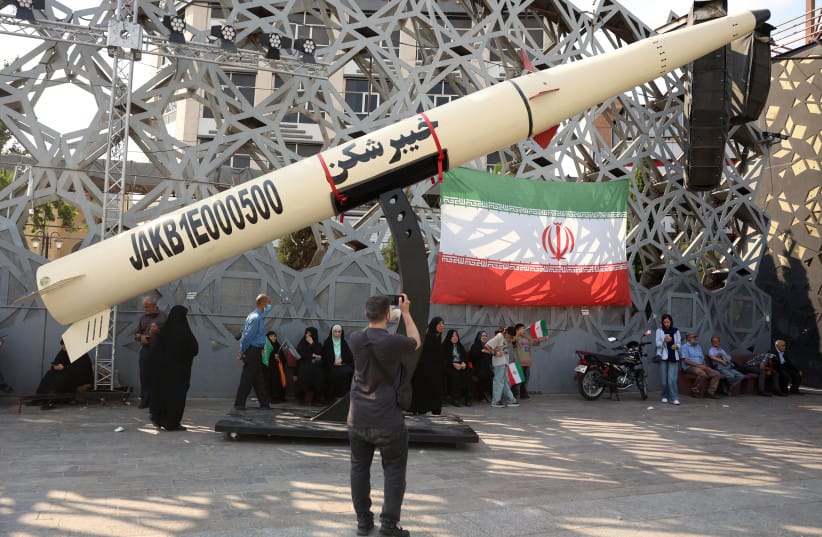 Iranians stand next to a symbol of a Kheibar missile as they take part in a rally in support of the country’s Supreme Leader Mojtaba Khamenei and commemorate Eid al-Ghadir in Tehran in June.