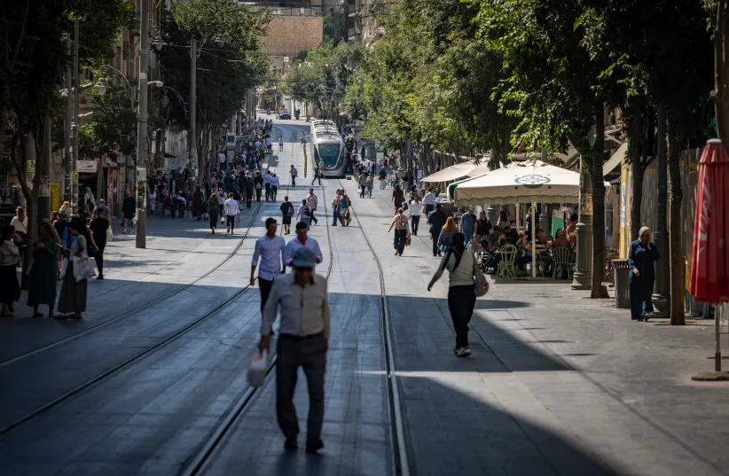 People walk on Jaffa Street in central Jerusalem, June 15, 2026.