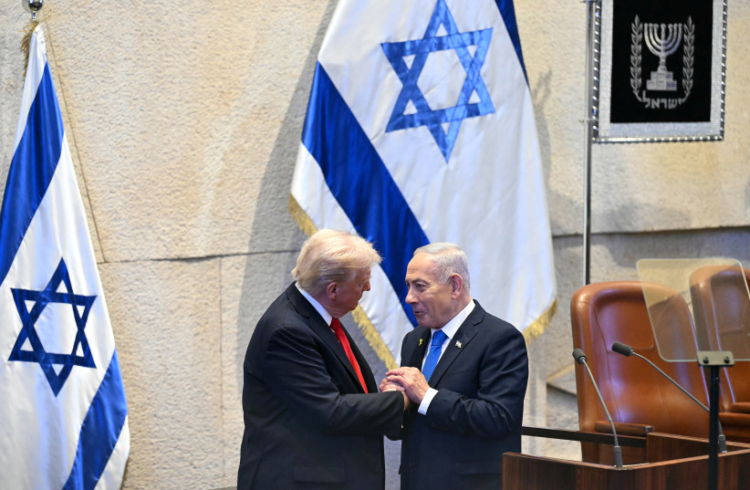 President Trump Visits Israel And Egypt After Gaza Ceasefire Takes Effect JERUSALEM - OCTOBER 13: U.S. President Donald Trump (L) holds hands and speaks with Israeli Prime Minister Benjamin Netanyahu at the Israeli parliament, the Knesset, on October 13, 2025 in Jerusalem. President Trump is visitin