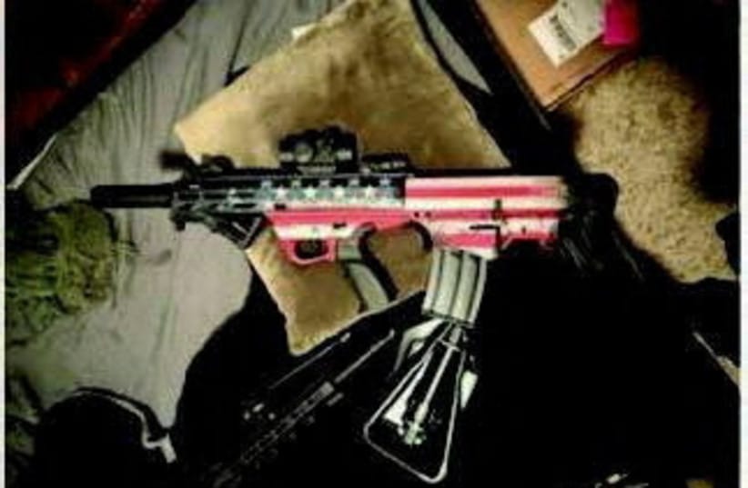 A photo of a suspect's gun is seen after the FBI said it thwarted a potential attack on the Ultimate Fighting Championship mixed martial arts event on the White House lawn on the weekend, in this handout image provided by the US Department of Justice in Washington.