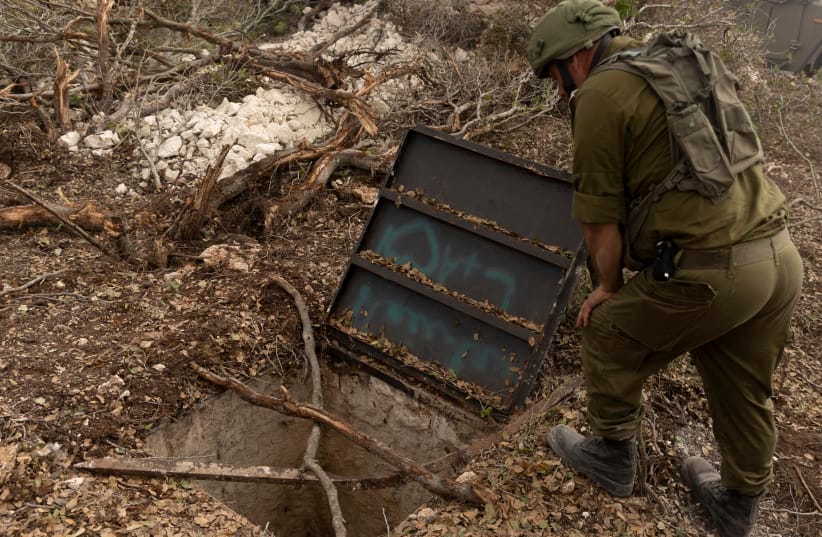 An Israeli soldier inspects a Hezbollah attacking position tunnel found during anIDF operation.