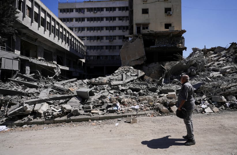 A person inspects the damage in the aftermath of an Israeli strike in Nabatieh, Lebanon June 21, 2026