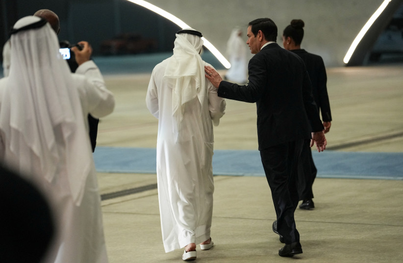 U.S. Secretary of State Marco Rubio speaks with UAE Ambassador to the U.S. Yousef Al Otaiba upon his arrival at Al Bateen Executive Airport to discuss the interim deal between the U.S. and Iran with Arab Gulf allies, in Abu Dhabi, United Arab Emirates, June 23, 2026.