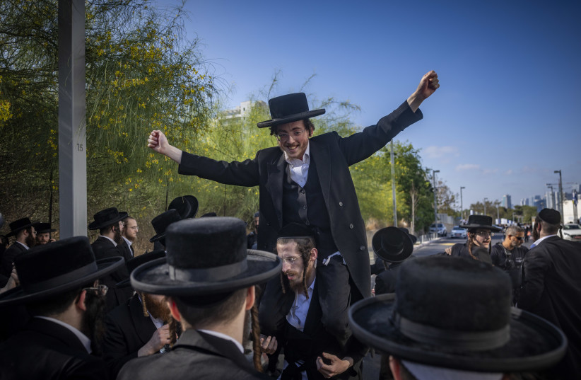 Ultra-Orthodox Jewish protesters demonstrate against the arrest of ultra orthodox jewish men who took part in a protest outside the home of Supreme Court Justice Noam Sohlberg and were later handed over to the military police, outside the Abu Kabir detention facility in Tel Aviv, June 10, 2026.