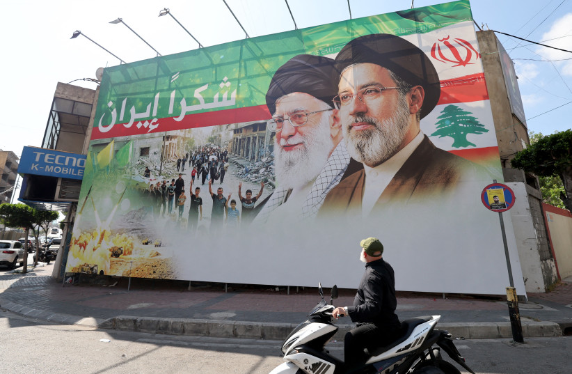 A giant billboard in Dahiyeh, Beirut’s southern suburbs depicts the late Iranian leader Ayatollah Ali Khamenei (C), and Iranian Supreme Leader Ayatollah Mojtaba Khamenei, with Arabic writing that reads: ‘Thank you Iran’ on June 15.