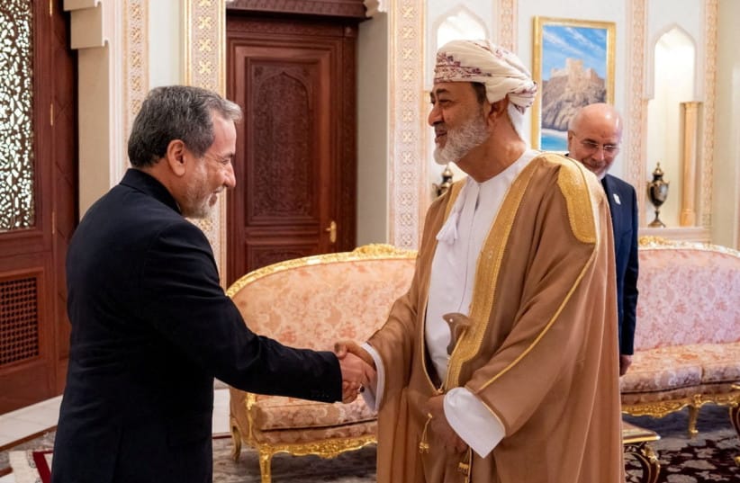 Iranian Foreign Minister Abbas Araqchi shakes hands with Sultan of Oman Haitham bin Tariq Al Said in Muscat, Oman, June 23, 2026. (credit: OMAN NEWS AGENCY/HANDOUT VIA REUTERS)