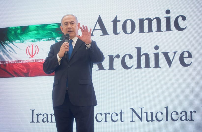 Prime Minister Benjamin Netanyahu exposes files that prove Iran's nuclear program in a press conference at the Kirya government headquarters in Tel Aviv, on April 30, 2018 (credit:  Miriam Alster/Flash90)