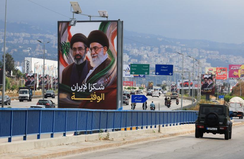 Vehicles drive past billboards showing Iran’s Supreme Leader Ayatollah Mojtaba Khamenei and his late father, with the slogan “Thank you to loyal Iran” erected along the highway leading to Rafic Hariri International Airport in Beirut, Lebanon, June 22, 2026