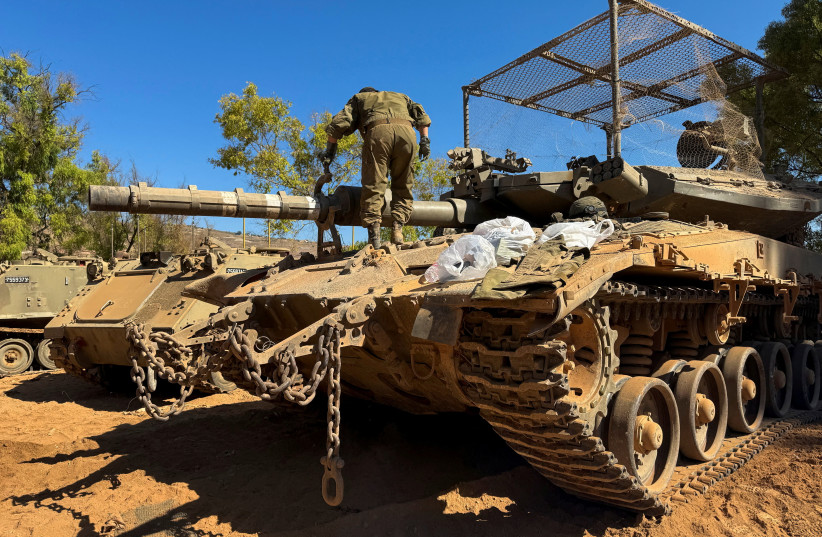 An Israeli soldier works on a tank on the Israeli side of the Israel-Lebanon border, after Israel and Lebanon signed a framework agreement following U.S.-mediated talks, in northern Israel, June 28, 2026.