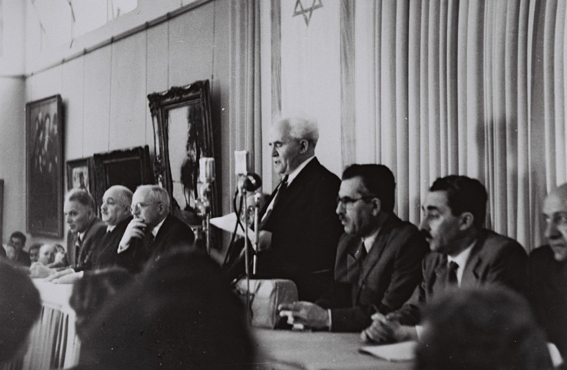 David Ben-Gurion, flanked by members of the provisional government, reads Israel’s Declaration of Independence. The US was the first country to recognize Israel as an independent state.