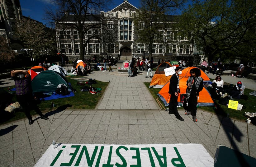 A banner is displayed on the main quad of the City College of New York’s Harlem campus, as students and supporters of the pro-Palestinian movement demonstrate at an encampment in April 2024.