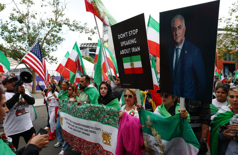 June 26, 2026 Protesters display banners reading ''don't stop speaking about Iran'' and of former Crown Prince of Iran, Reza Pahlavi outside a World Cup stadium before the match.