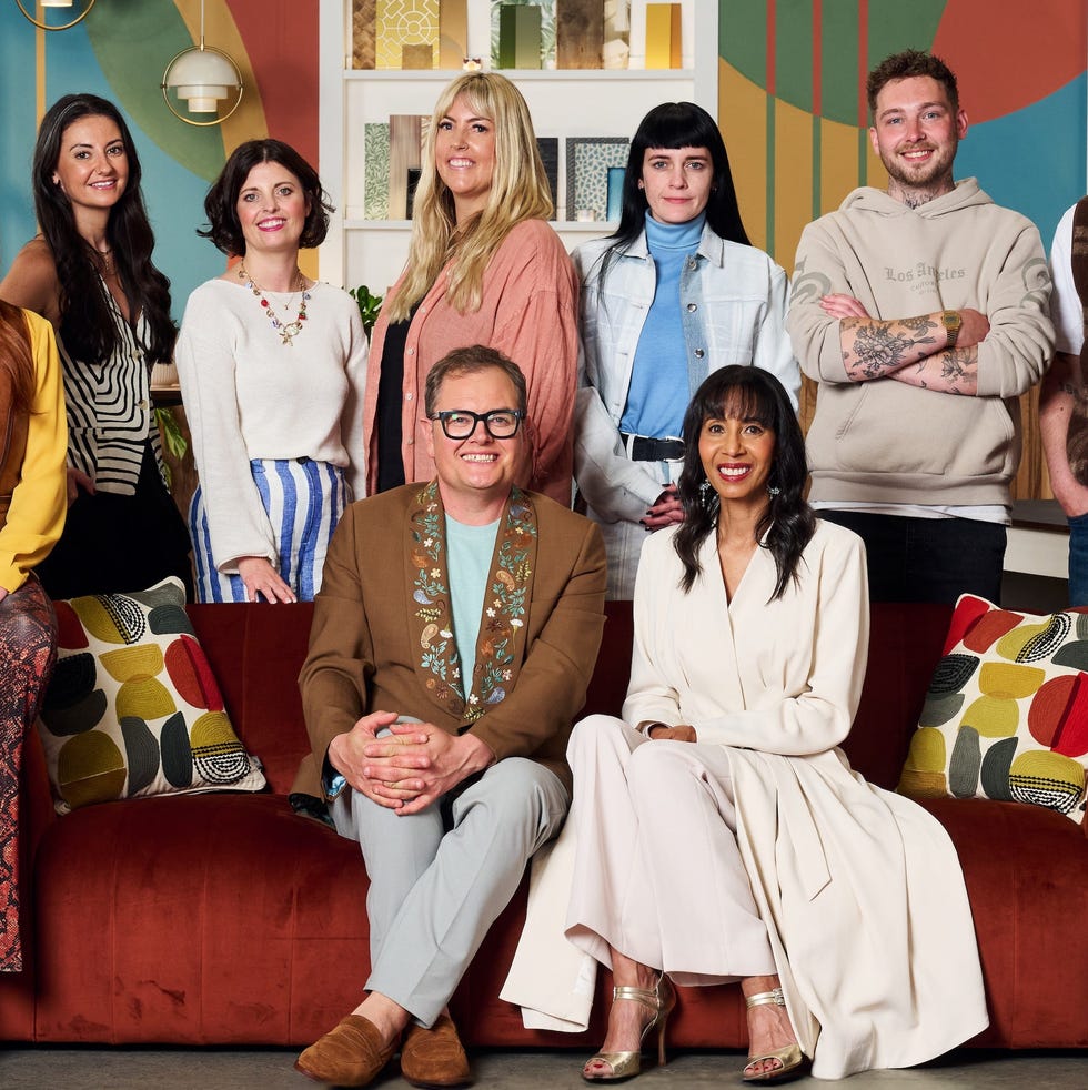 group of individuals posed together in a stylish interior setting group of individuals posed together in a stylish interior setting
