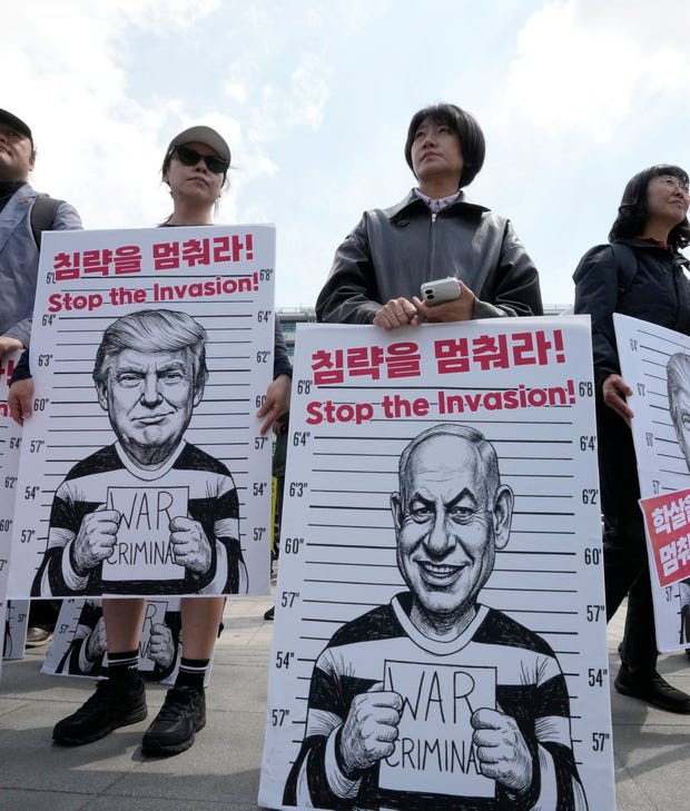 Anti-war activists holding banners depicting U.S. President Donald Trump and Israeli Prime Minister Benjamin Netanyahu during a rally near the U.S. Embassy in Seoul, South Korea, in April. Credit: Ahn Young-joon/AP Anti-war activists holding banners depicting U.S. President Donald Trump and Israeli Prime Minister Benjamin Netanyahu during a rally near the U.S. Embassy in Seoul, South Korea, in April.