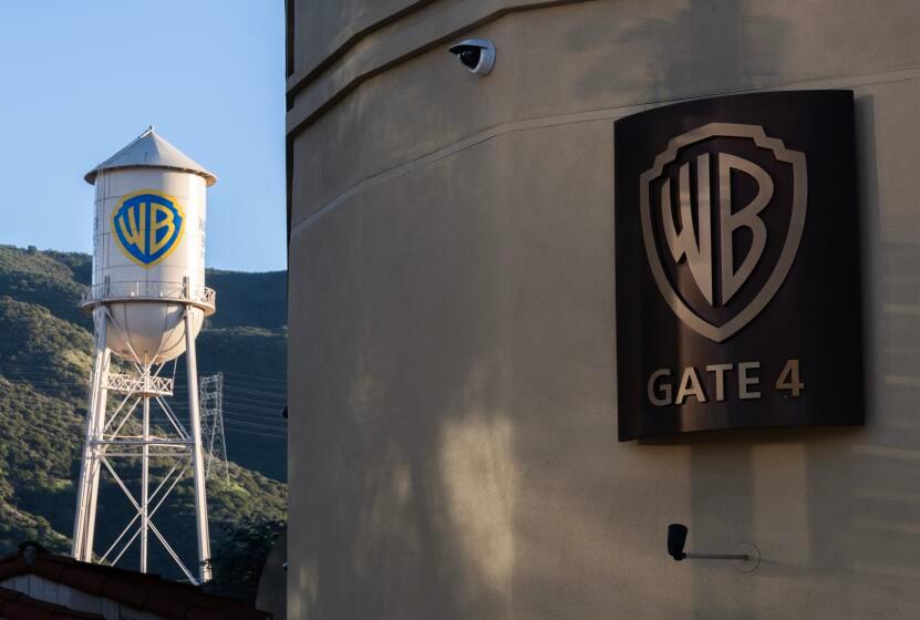 Warner Bros. Studio Gate 4 entrance in Burbank, with iconic water tower in distance