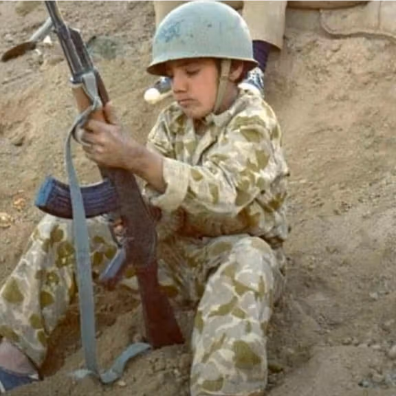 File photo showing a child at the front line during the Iran-Iraq War.