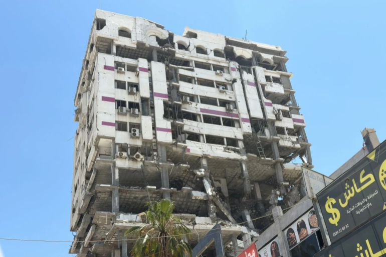 Palestine Tower, once a prominent hub for major tech, entrepreneurship, and freelance companies in the Gaza Strip, stands in ruins after being destroyed during the Israeli war [Eyad Al-Qatrawi].