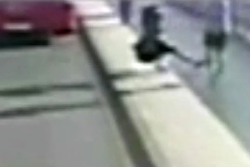 The man was seen pushing the woman into the path of a double-decker bus (PA)