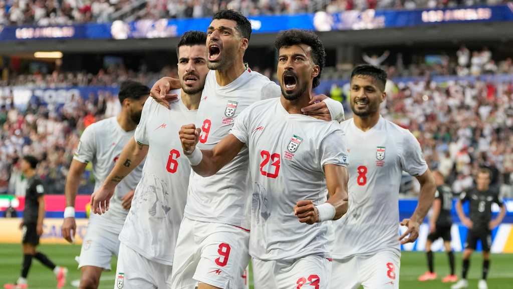 Iran opens its politically charged World Cup