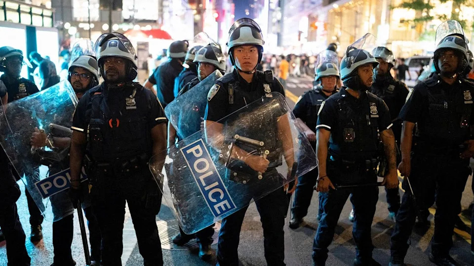 Police officers prepare to disperse the crowd after the New York Knicks' win against the San Antonio Spurs in Game 5 of the NBA Finals at Bryant Park in New York City, U.S., June 13, 2026.