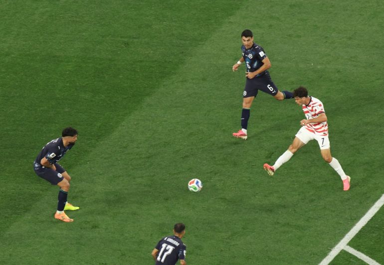 US midfielder #07 Giovanni Reyna (R) scores his team's fourth goal during the 2026 World Cup Group D football match
