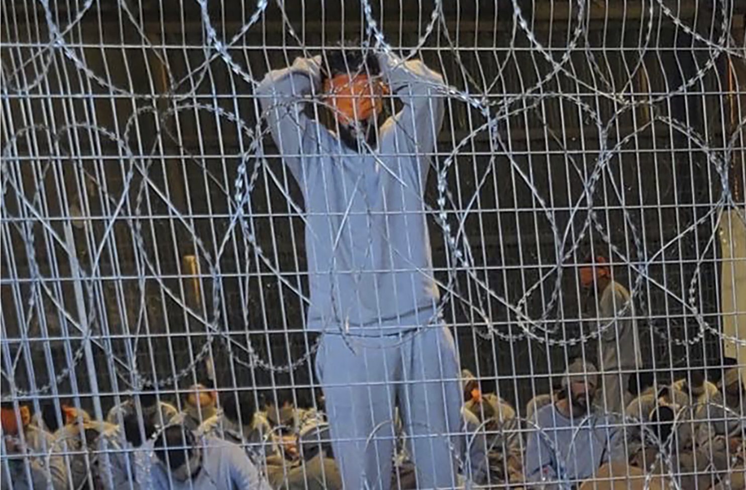 This undated photo from Winter 2023 provided by Breaking The Silence, a whistleblower group of former Israeli soldiers, shows blindfolded Palestinian prisoners captured in the Gaza Strip by Israeli forces at a detention facility on the Sde Teiman military base in southern Israel. (Breaking The Silence via AP)