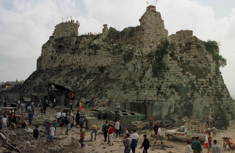Villagers inspect the damage to Beaufort Castle, 10km (6 miles) northwest of the southern market town of Nabatieh, Lebanon, Wednesday, on May 24, 2000 [Ahmed Mantash/AP Photo]