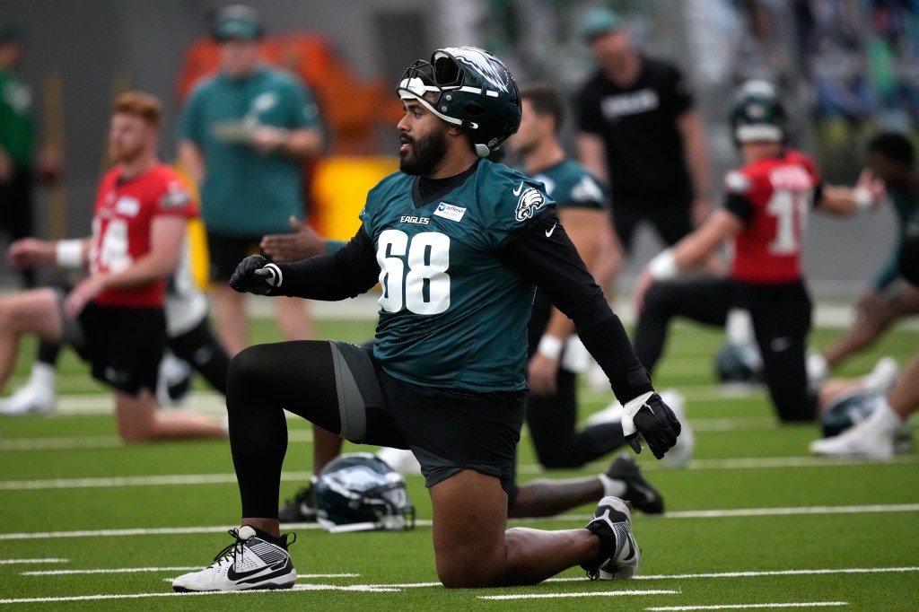 Philadelphia Eagles' Jordan Mailata stretches during practice at the NFL football team's training facility, Wednesday, May 27, 2026, in Philadelphia. 