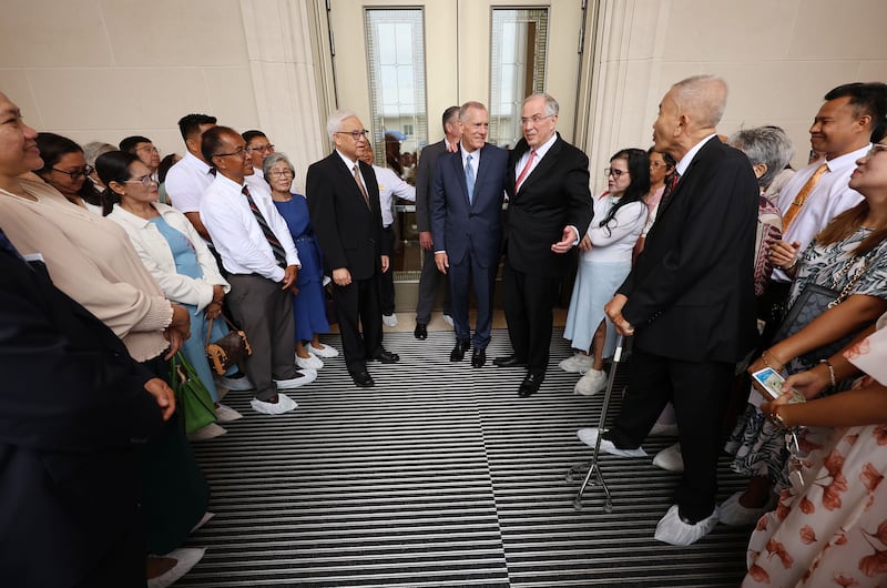 Elder Neil L. Andersen of the Quorum of the Twelve Apostles, center right, Elder Steven R. Bangerter, General Authority Seventy and executive director of the Temple Department, center, and Elder Chi Hong (Sam) Wong, General Authority Seventy and first counselor in the Philippines Area presidency,  greet attendees of the Bacolod Philippines Temple dedication in Bacolod City, Philippines, on Sunday, May 31, 2026.