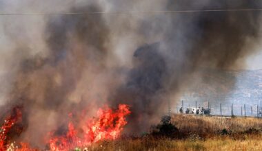 Israeli forces look on as a fire blazes in a field in the Palestinian town of Huwara in the occupied West Bank on June 6, 2026, after a reported arson attack by Israeli settlers according to local officials. Shielded by what Palestinians and rights group describe as complete impunity from the law, some Israeli settlers have harassed rural Palestinian communities, vandalising property, committing arson, sometimes killing. Excluding east Jerusalem, more than 500,000 Israelis live in the occupied West Bank in settlements that are illegal under international law, among some three million Palestinians. Israel has occupied the West Bank since 1967.