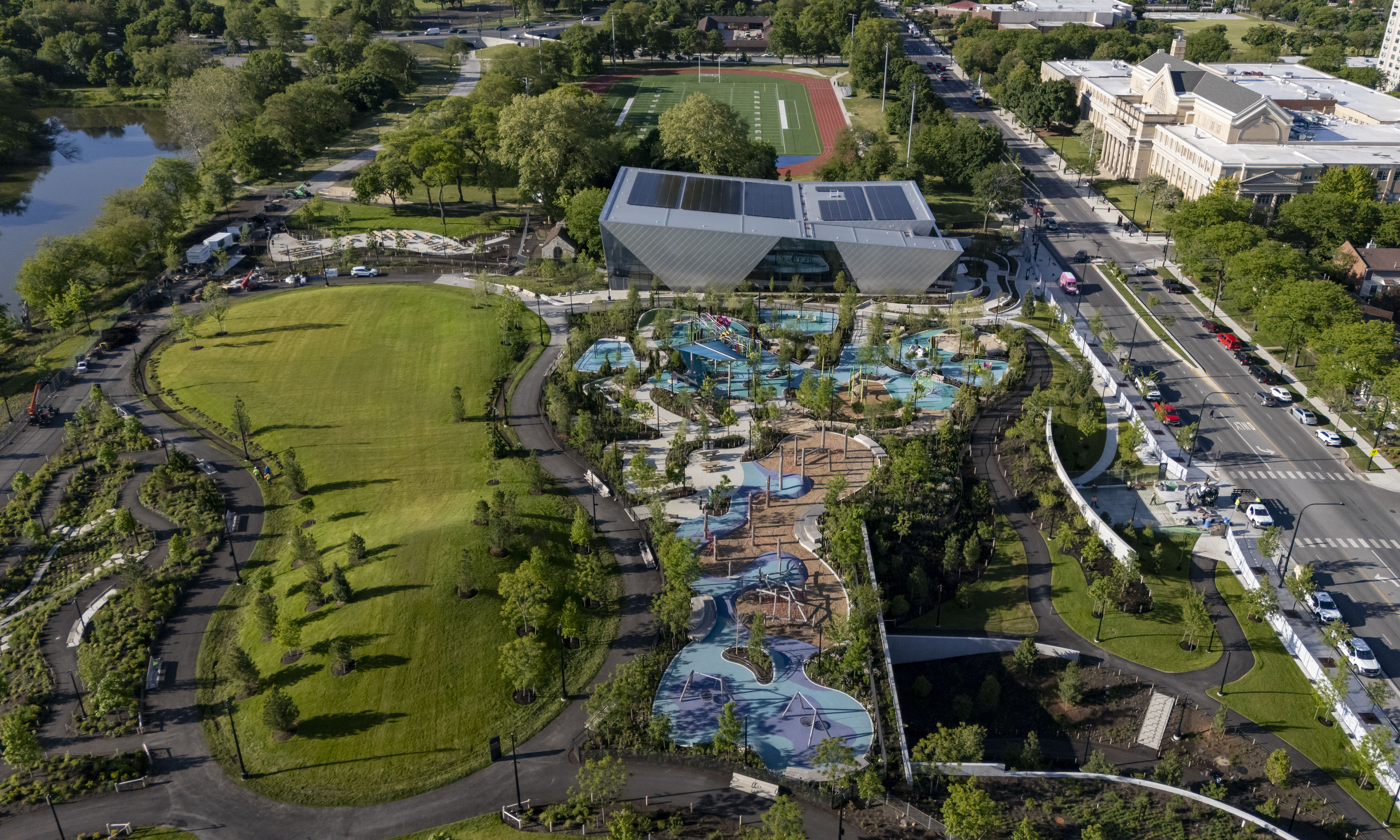 The great lawn and playground on the campus of the...