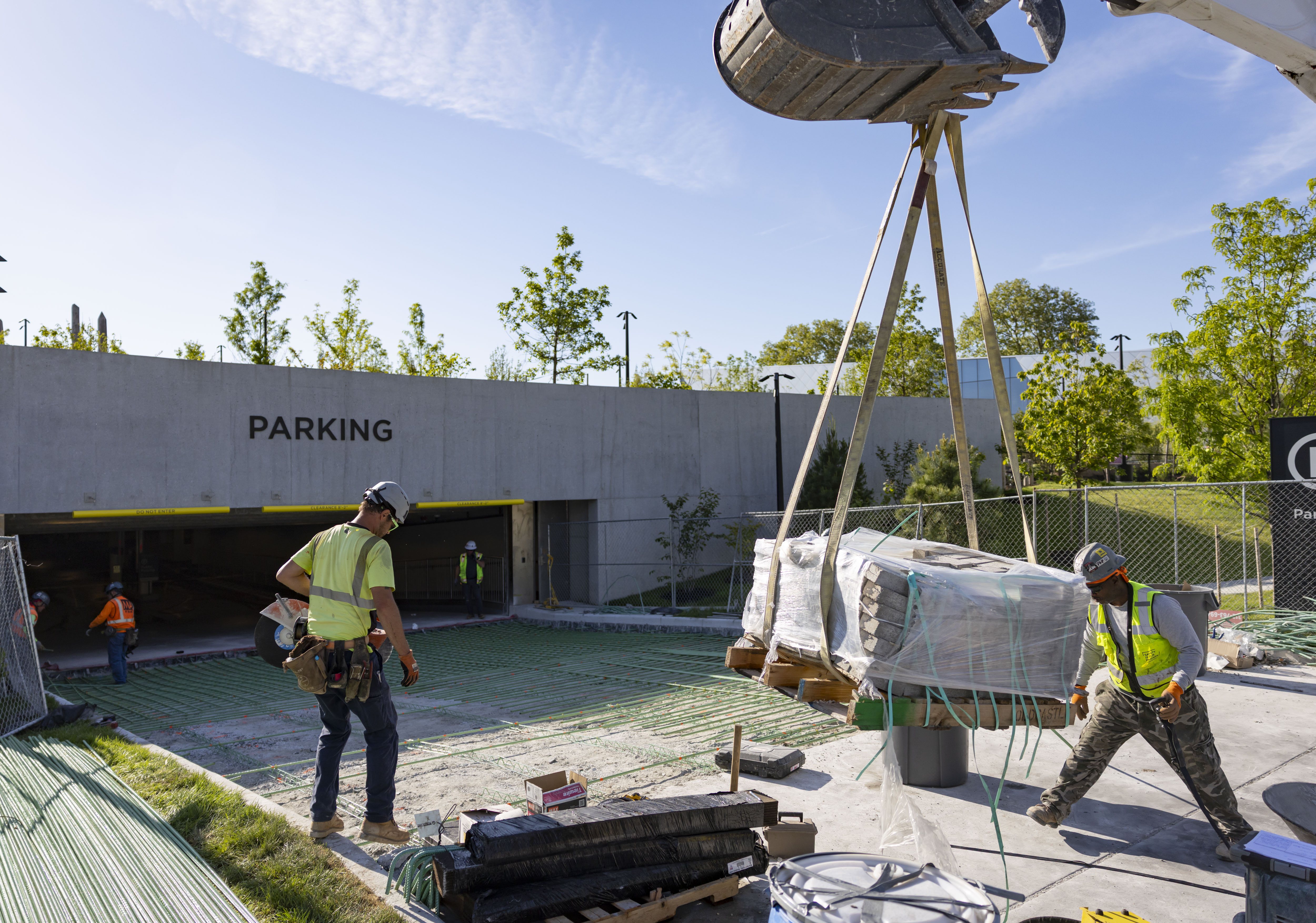 Workers finish the parking garage entrance as the Obama Presidential...