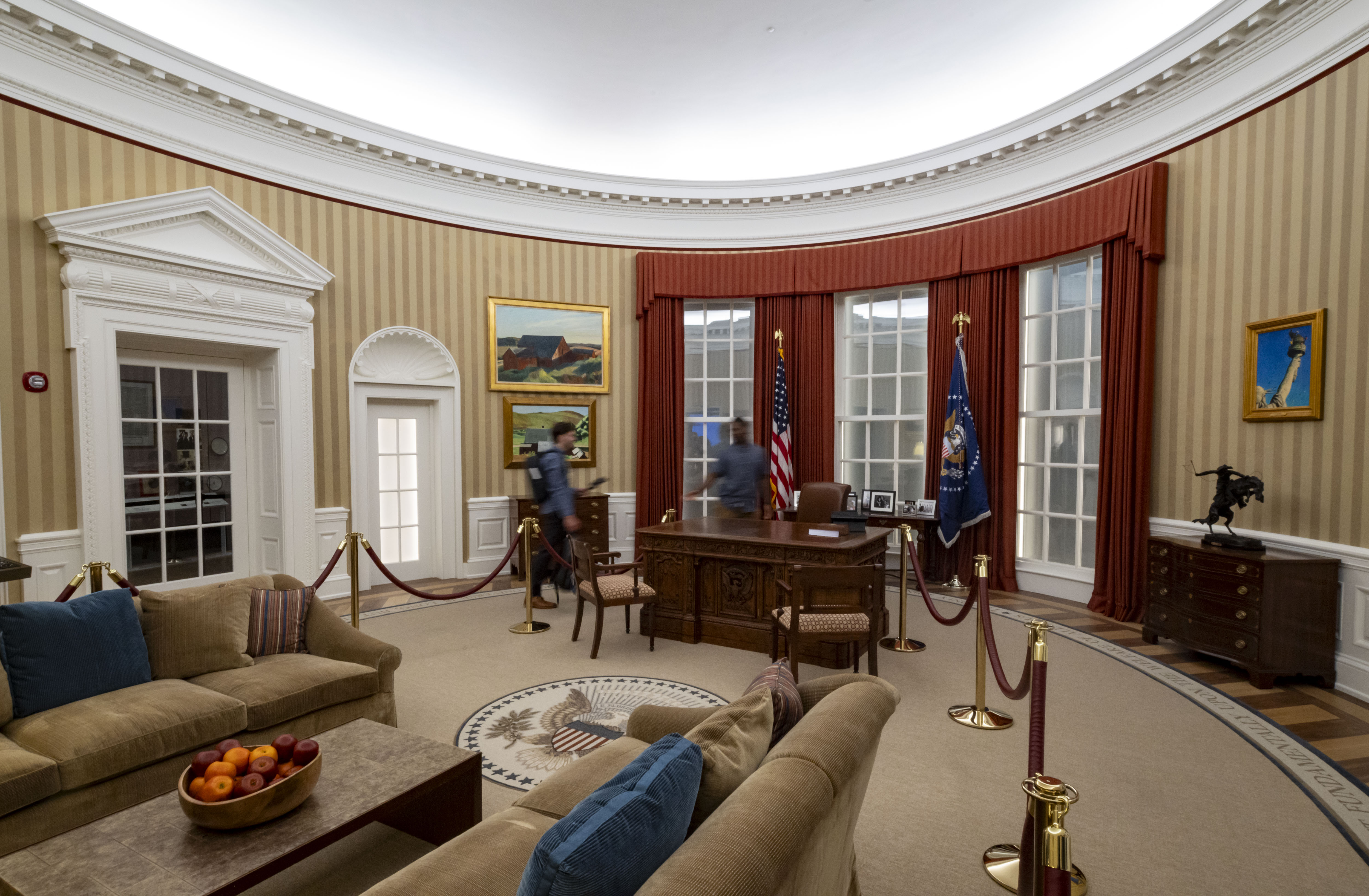 A replica of the Oval Office is on display as...