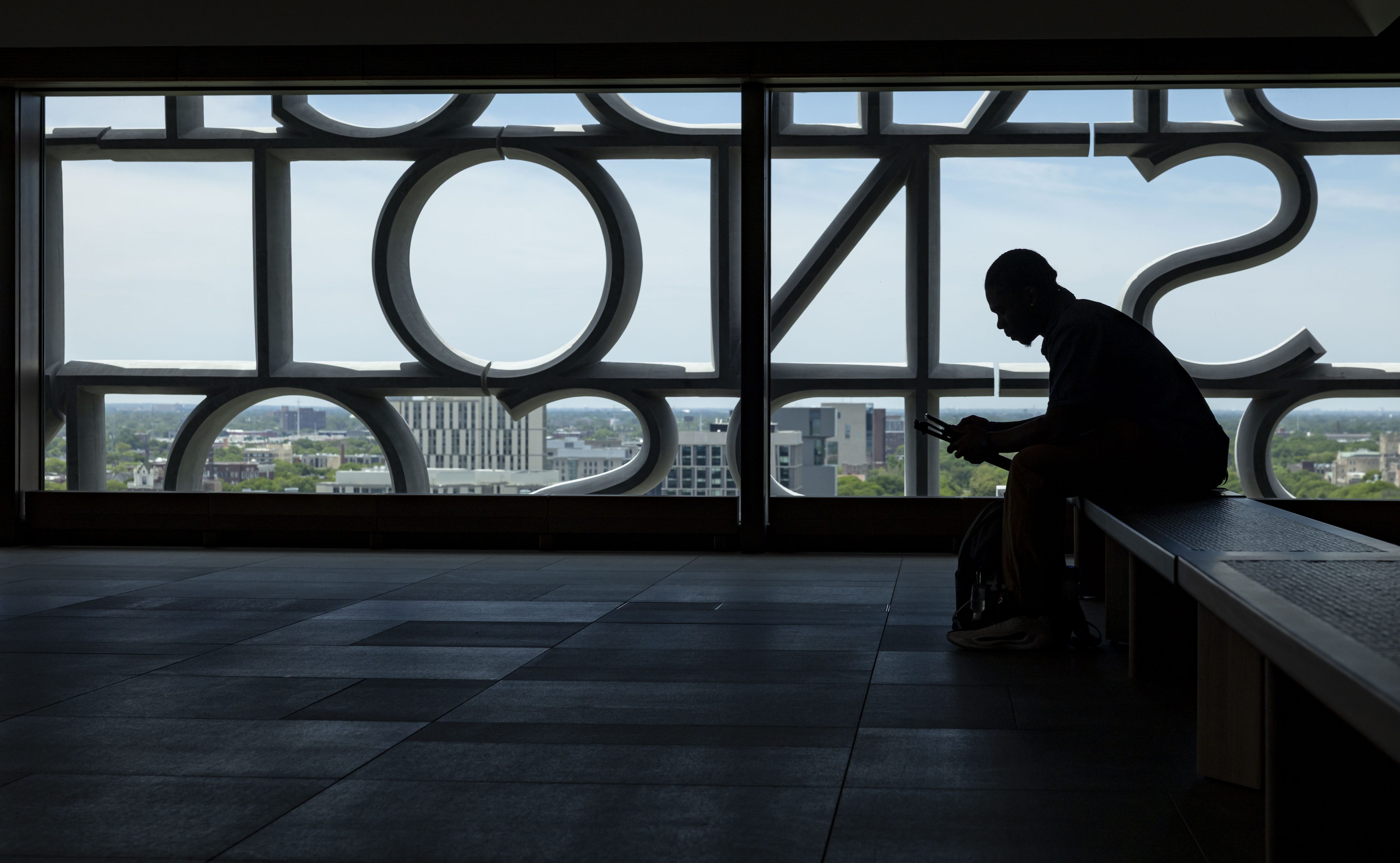 A visitor sits in the Sky Room as the Obama...