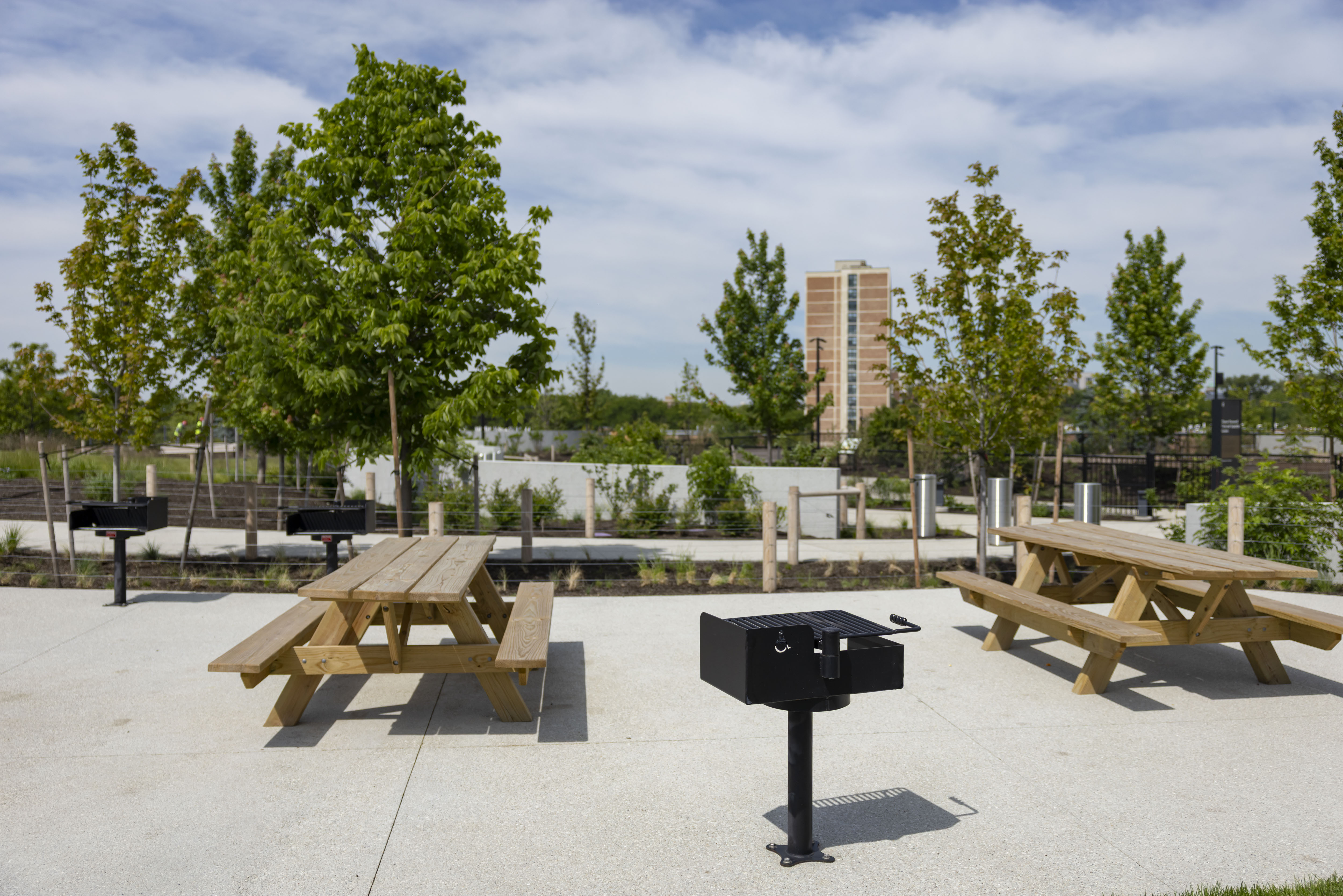 Barbecue grills and tables are available for the public on...