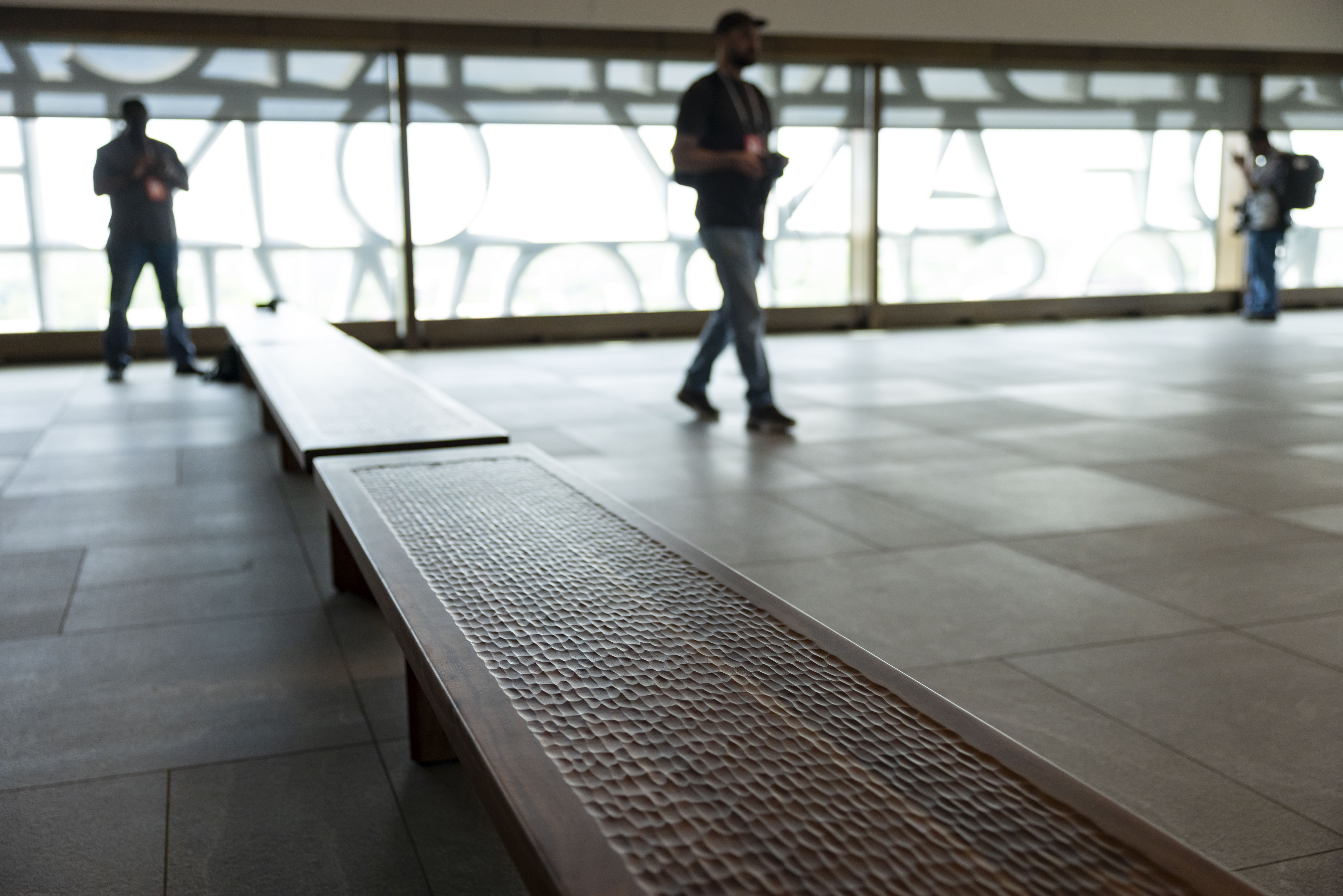 Carved wood benches are placed in the Sky Room at...