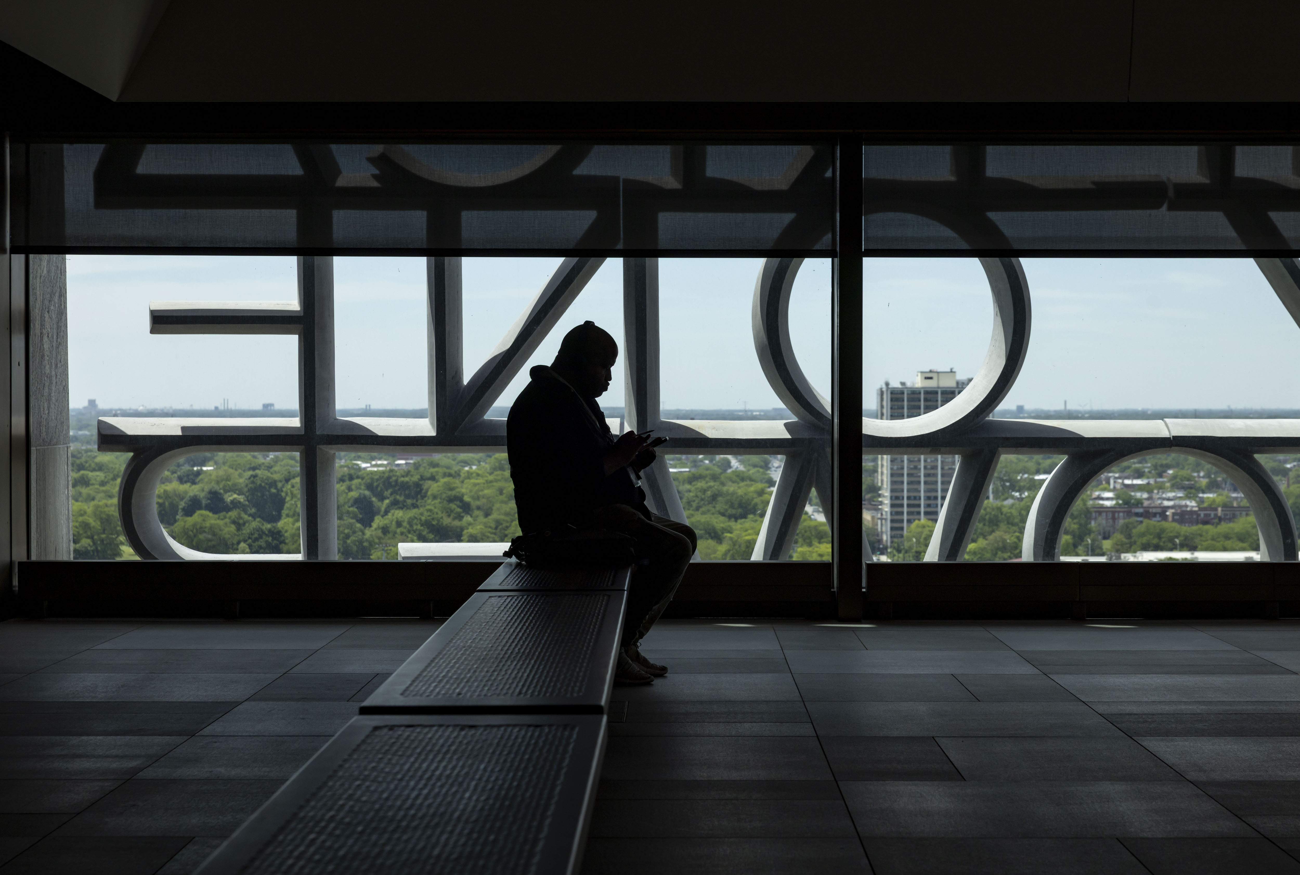 A visitor sits in the Sky Room at the Obama...
