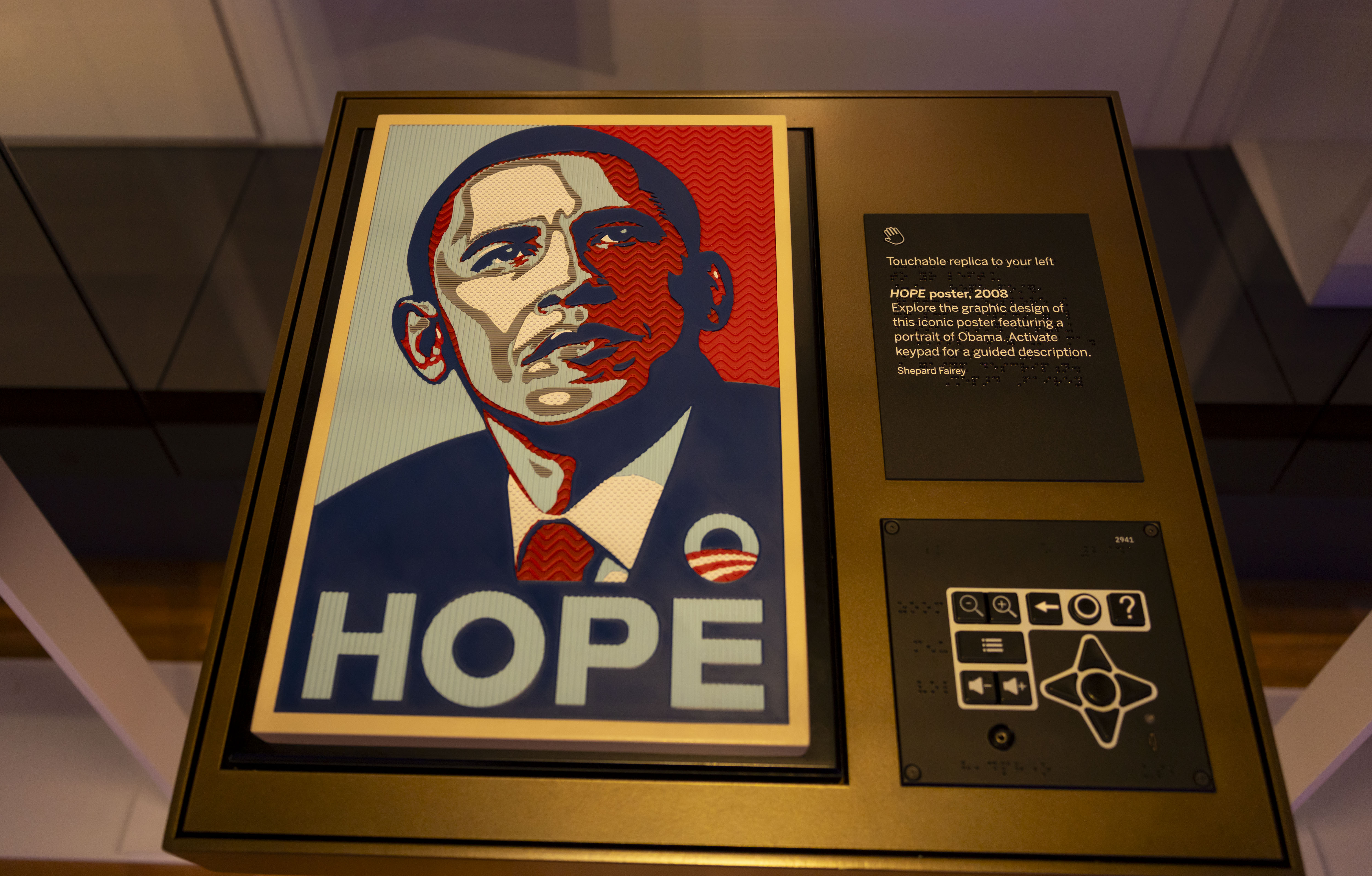 A sensory exhibit invites visitors to touch a reproduction of...