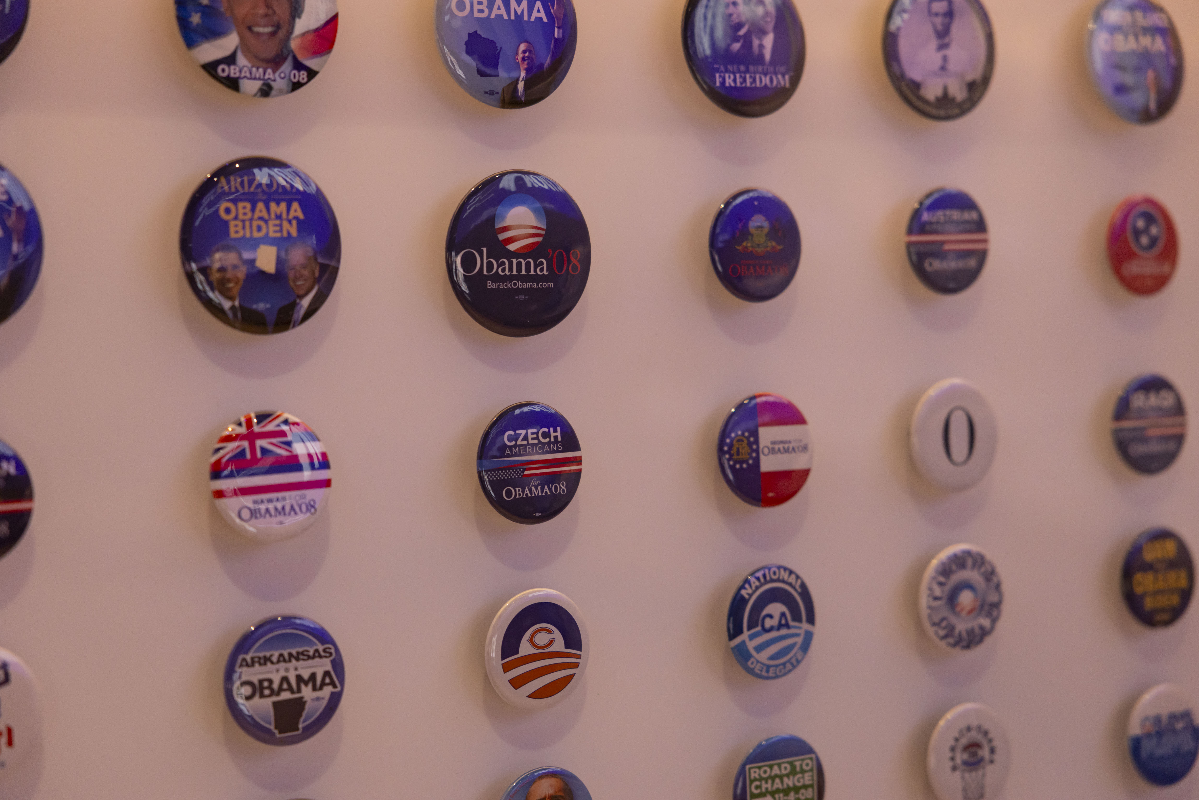 Campaign buttons from 2008 are displayed as the Obama Presidential...