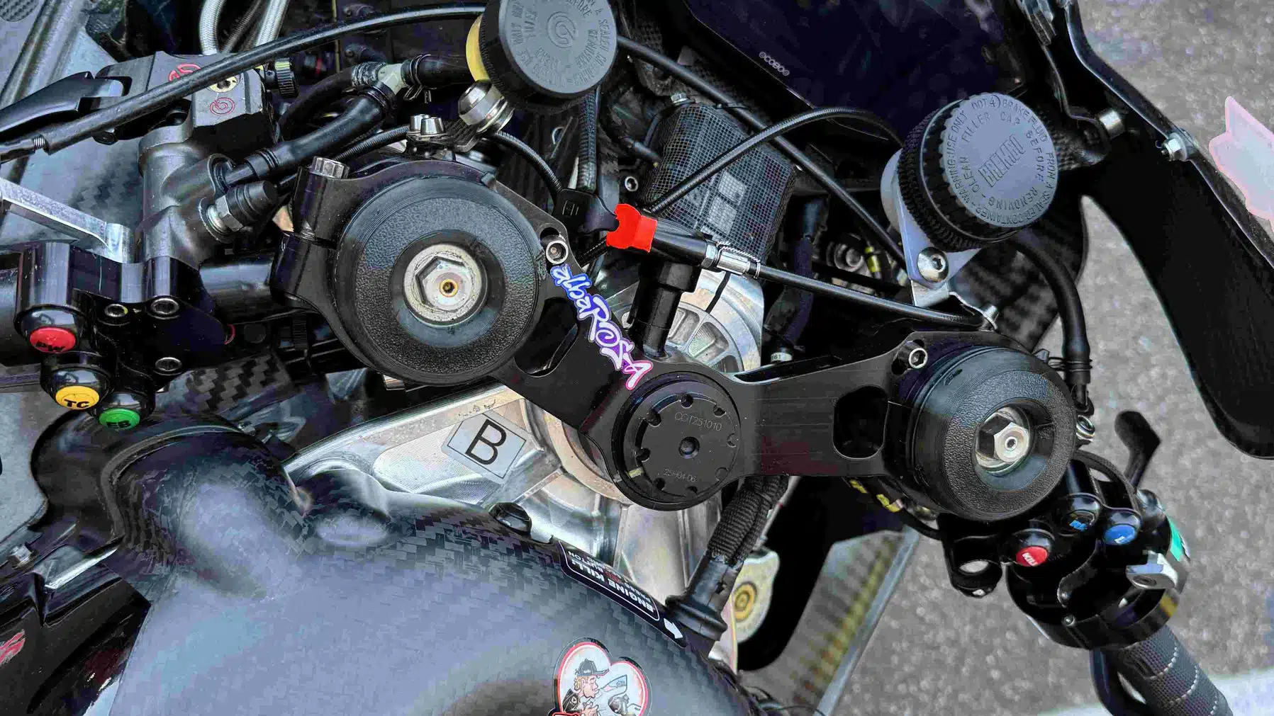 The Aprilia RS-GP’s front end, featuring exquisite work around the headstock. Red-painted control engages front holeshot device