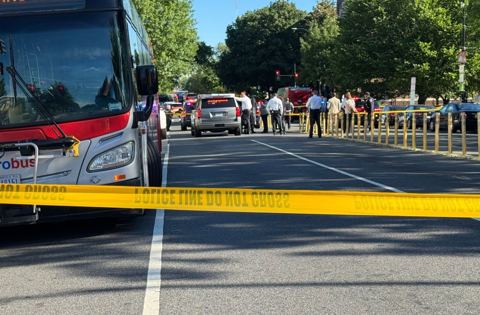 metrobus, police cars, crime tape