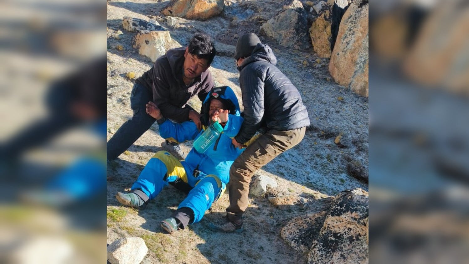 A photo showing SPCC workers helping Hillary Dawa Sherpa
