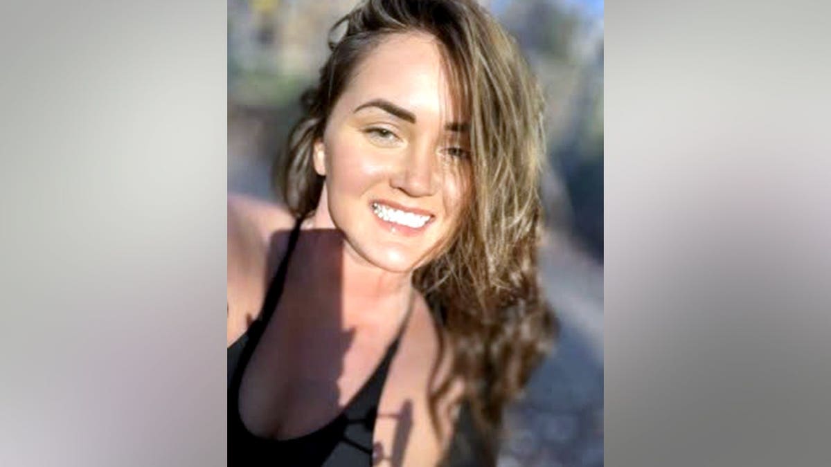 Elena Katherine Moore smiling in a photo
