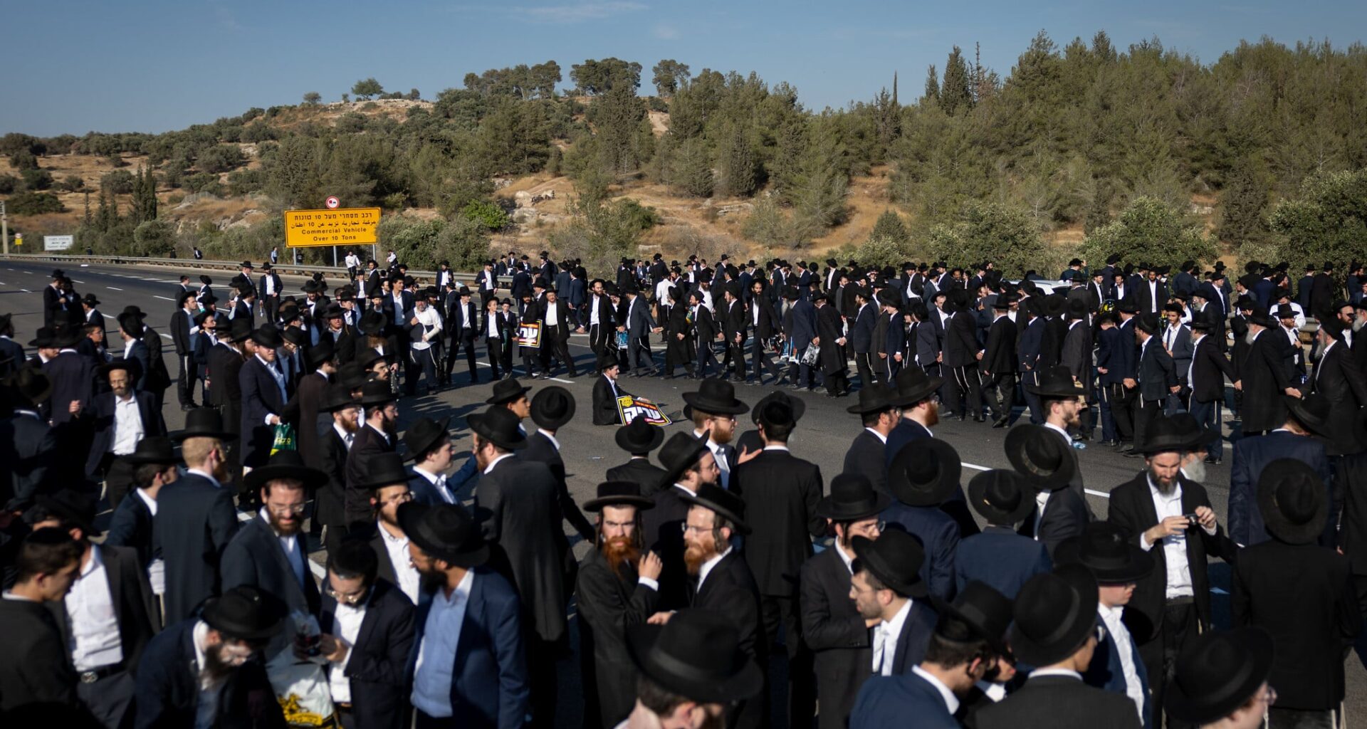 Rush-hour traffic blocked, drivers warned away, as major Haredi protests jam central Israel