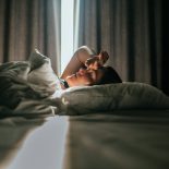 Woman awaking after sleeping well in a nice sleeping room. - stock photo