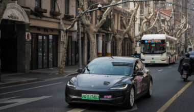 Tesla Model 3 vehicle drives on the street on February 27, 2025 in Shanghai, China.