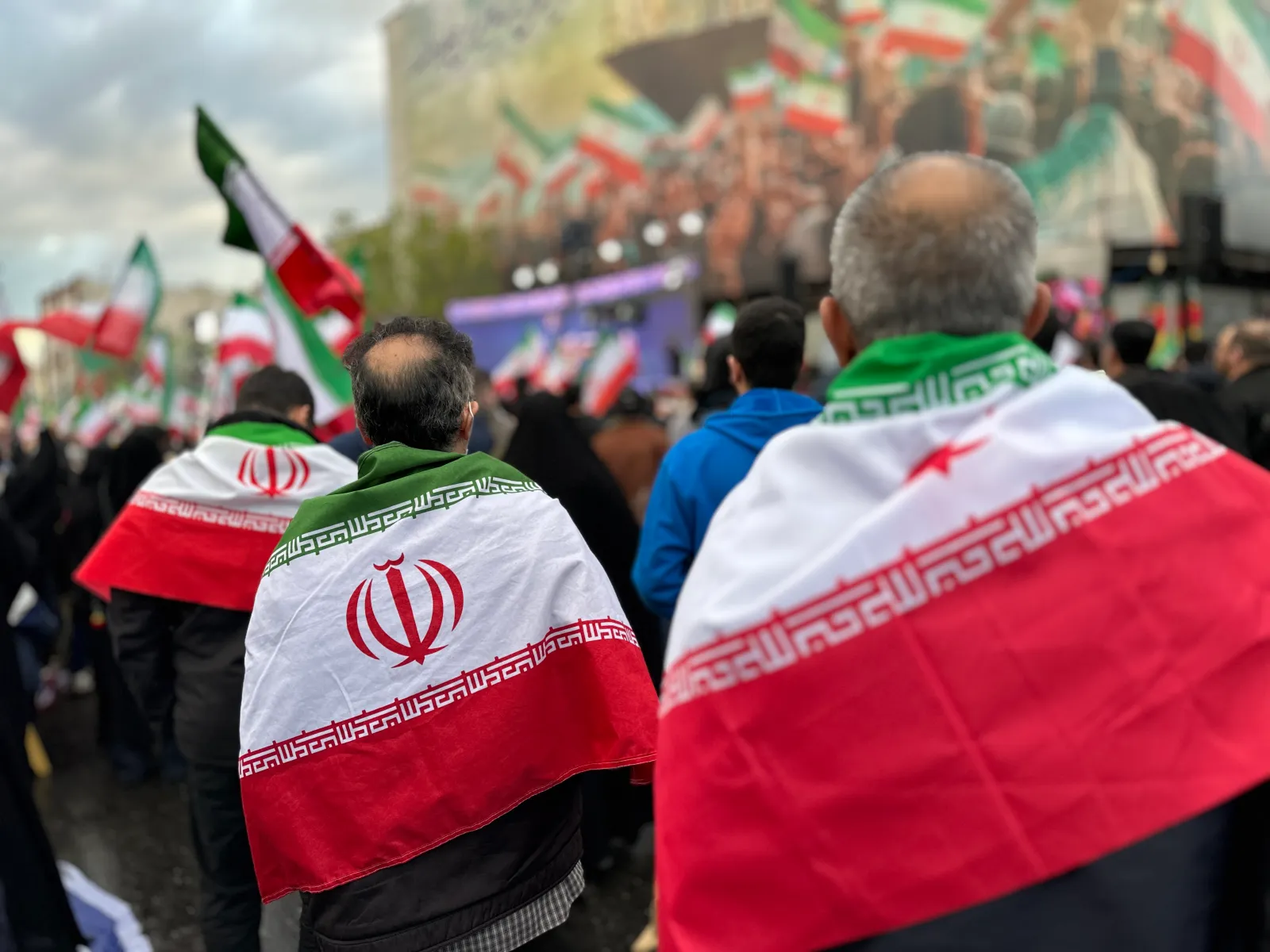 People with Iranian flags on the streets of Tehran.